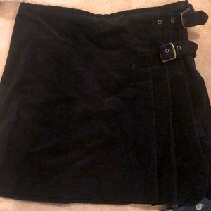 Black corduroy mini skirt. RUNWAY